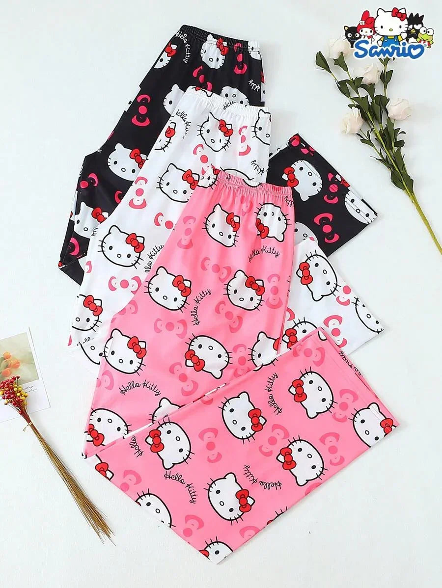 Hello Kitty pajama pants in pink, white, and black cotton with cute character print, Sanrio branding
