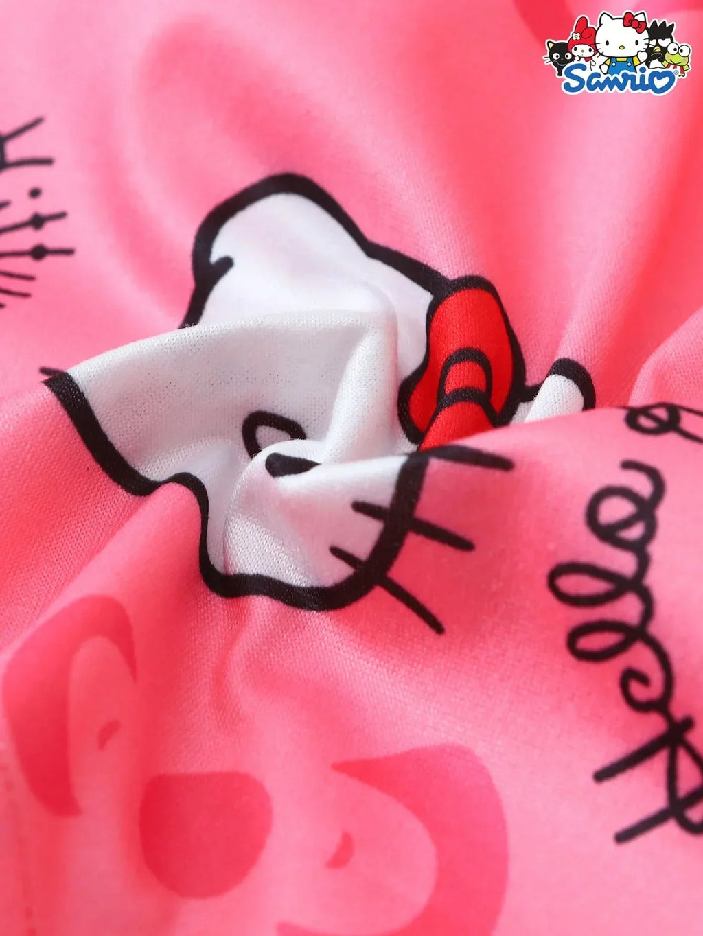 Hello Kitty pajama set pink cotton fabric close-up, character print and logo detail