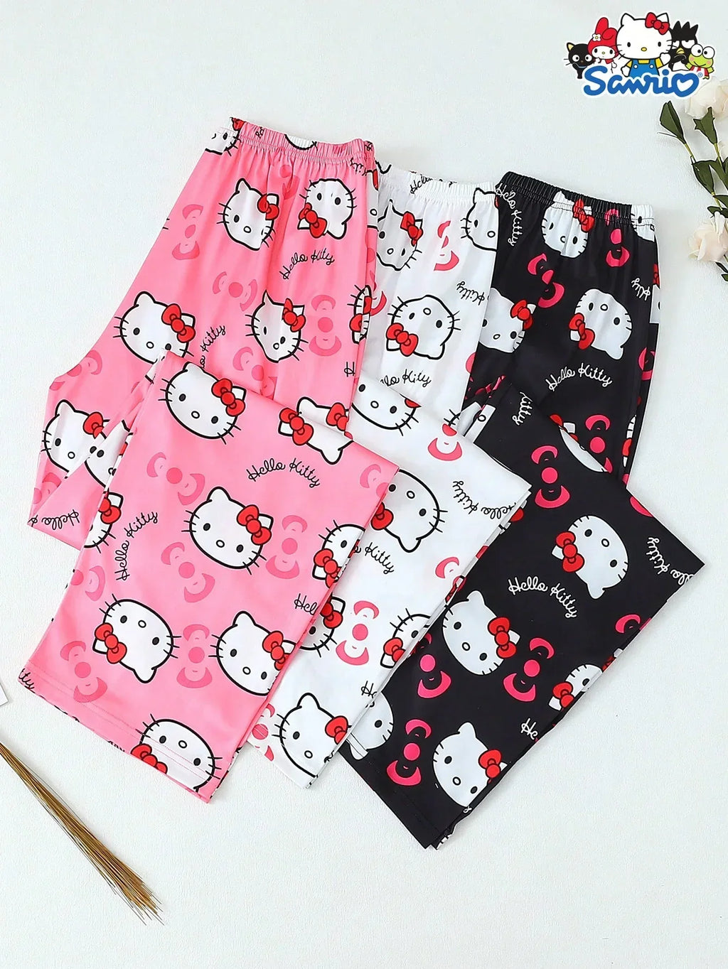 Hello Kitty pajama pants in pink, white, and black cotton by HUSTLE801, featuring cartoon print