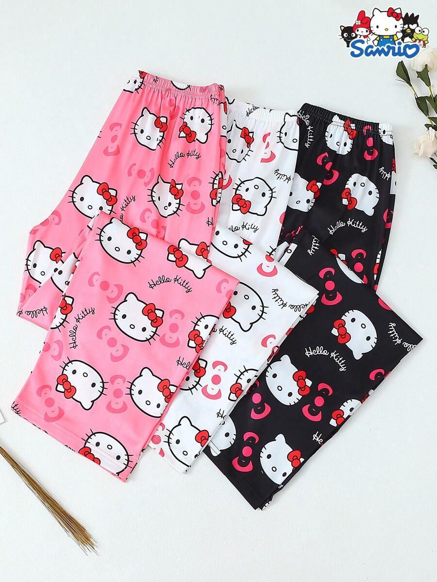 Hello Kitty pajama pants in pink, white, and black cotton with cartoon print shown by HUSTLE801