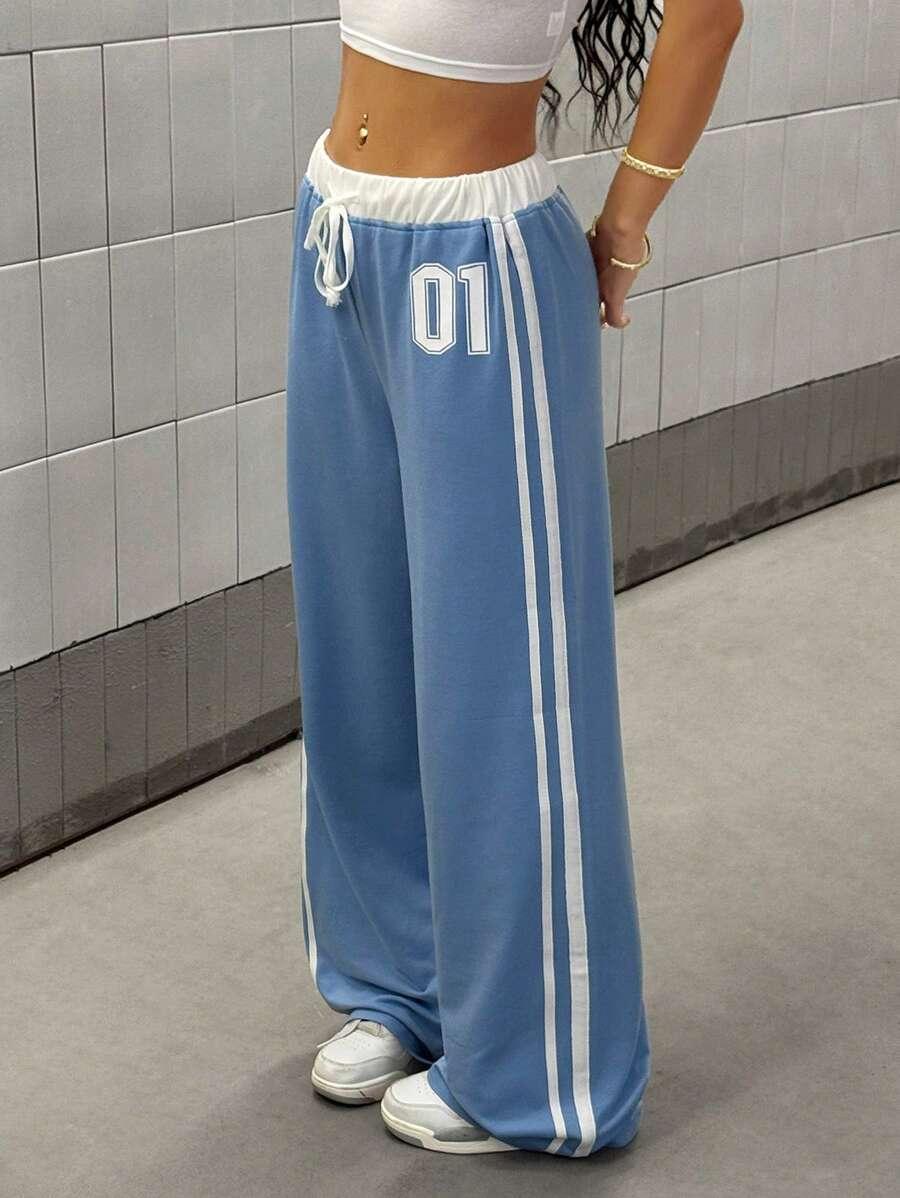 Blue cotton baggy sweatpants with white stripes and '01' patch, elastic waist, HUSTLE801