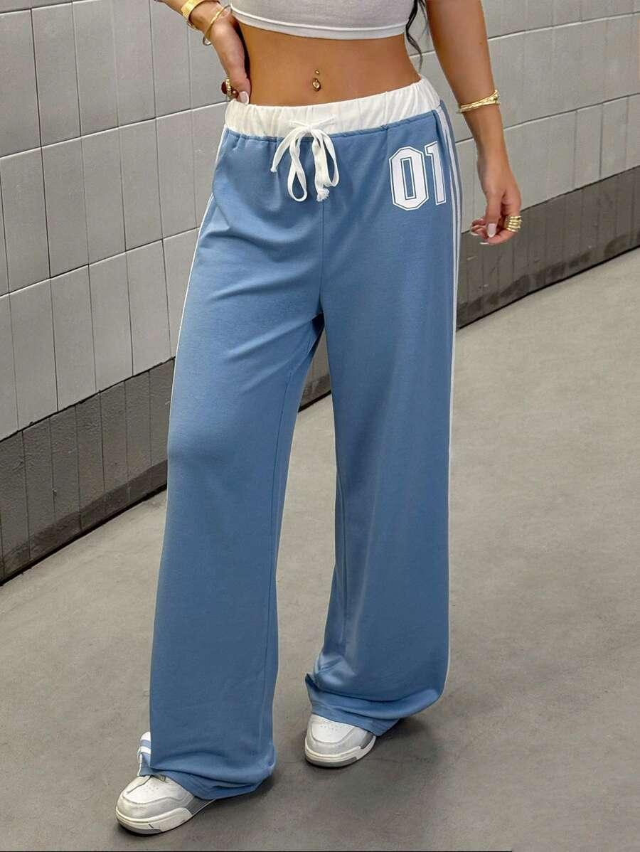 HUSTLE801 01 Sweatpants in light blue cotton with white drawstring waistband, relaxed fit