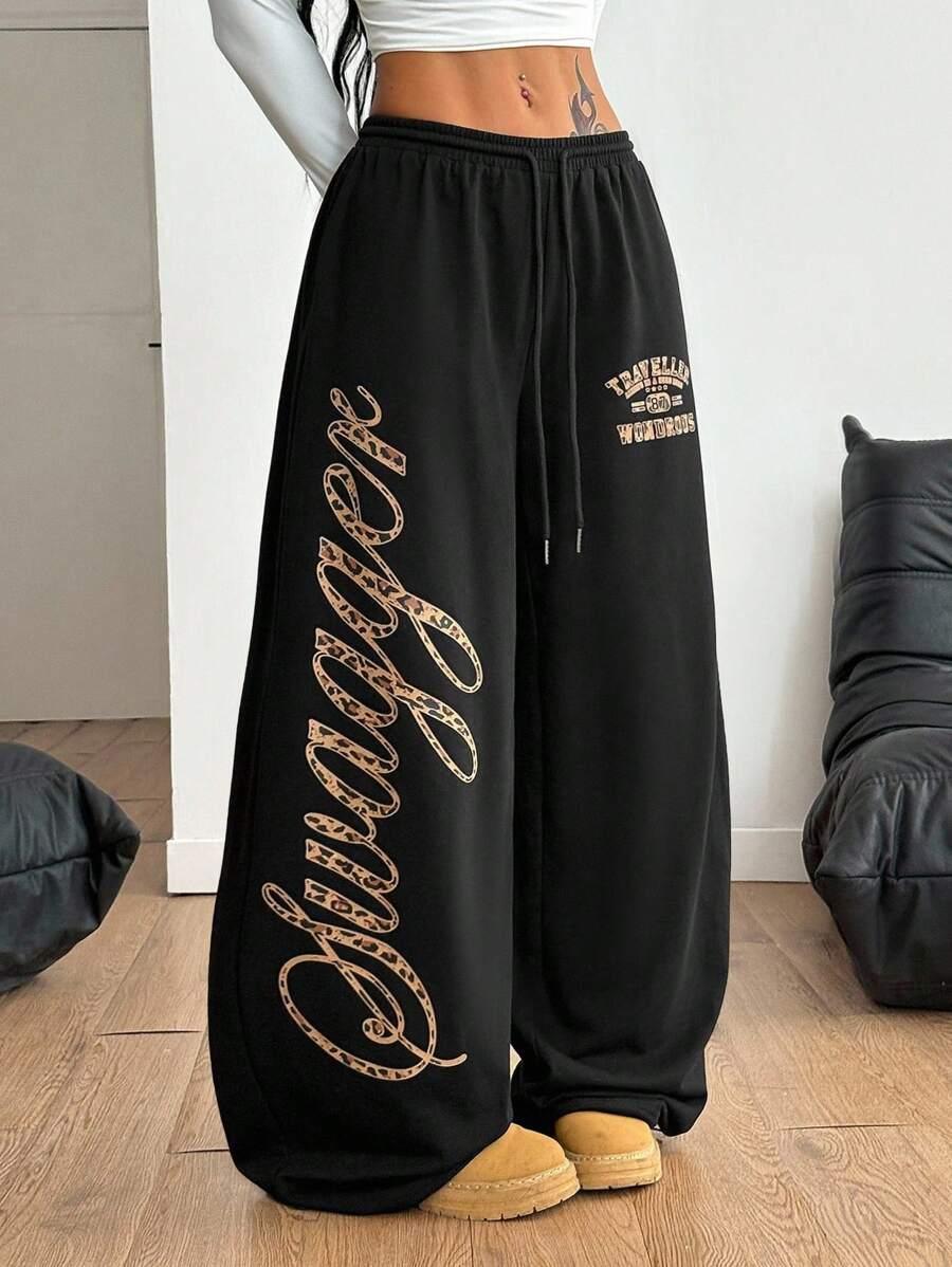 Black cotton baggy 'Swagger' sweatpants with leopard print lettering, HUSTLE801, streetwear style