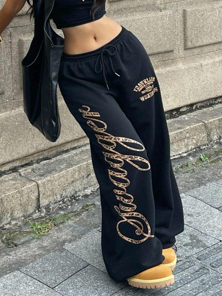 Savage black cotton sweatpants with leopard print letters and streetwear style, HUSTLE801