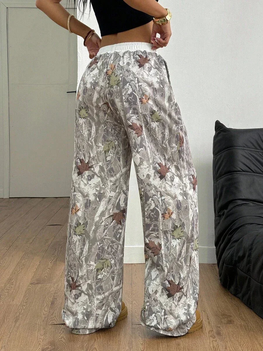 HUSTLE801 Camo Leaf Pants in gray cotton with brown and green print, relaxed fit, elastic waistband
