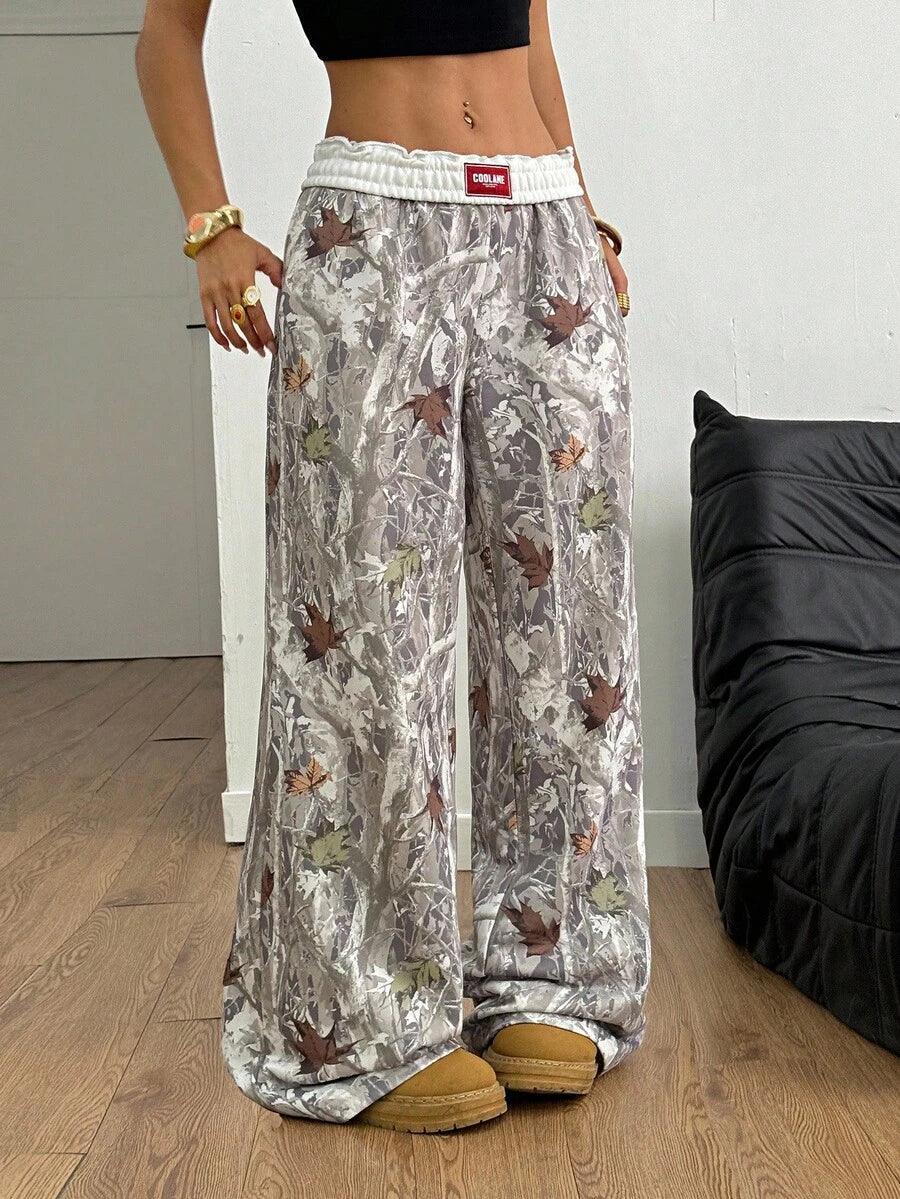 COOLANE camo leaf print baggy pants in gray cotton, wide leg, modeled indoors, HUSTLE801