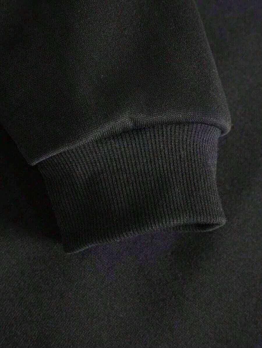 Black cotton ribbed cuff on HUSTLE801 That Girl sweatshirt, closeup sleeve detail