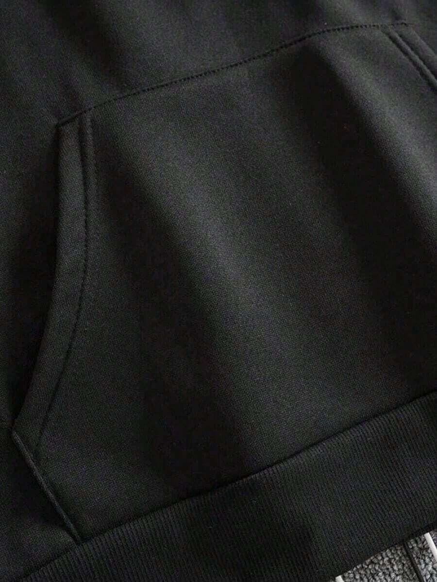 Black cotton hoodie kangaroo pocket closeup, soft fabric, HUSTLE801 minimalist streetwear