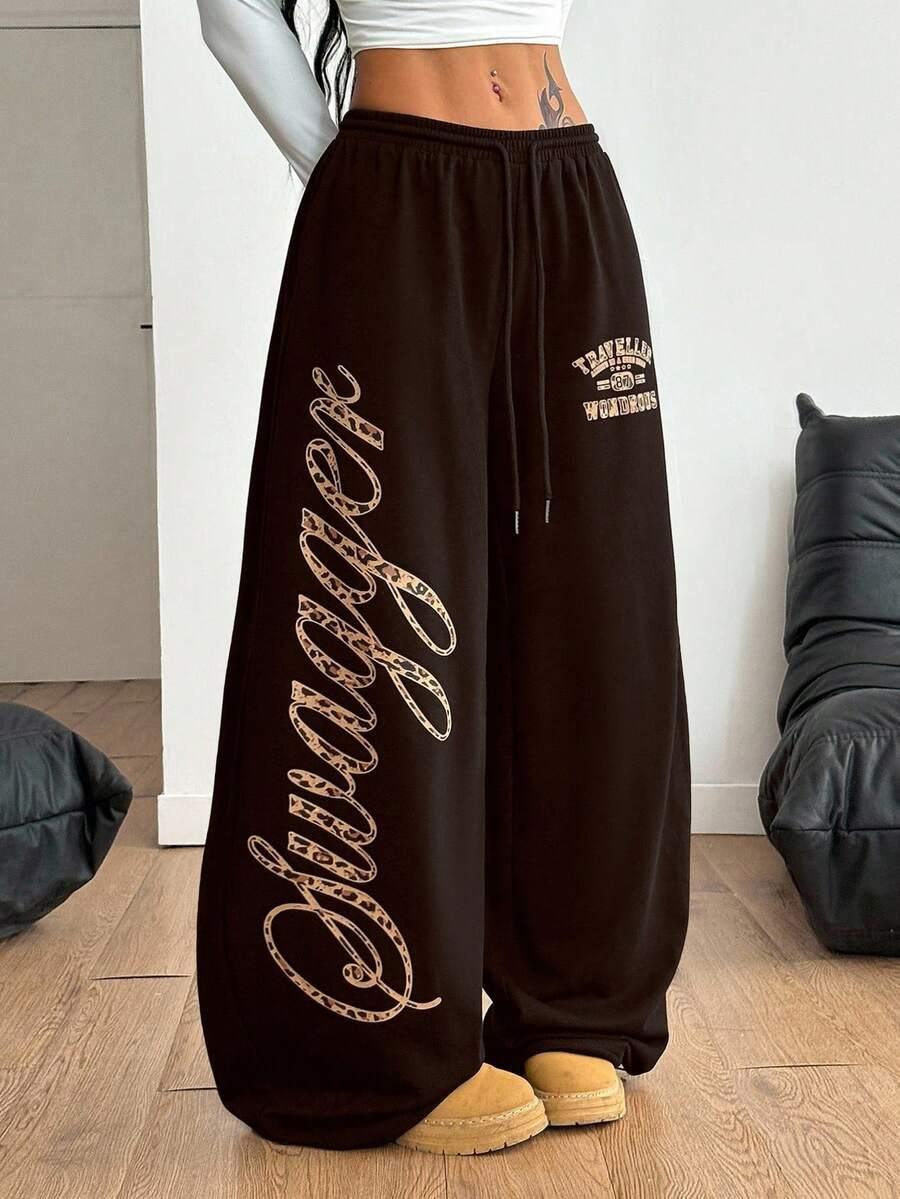 Brown cotton HUSTLE801 Swaggy baggy sweatpants with leopard print lettering, wide leg fit