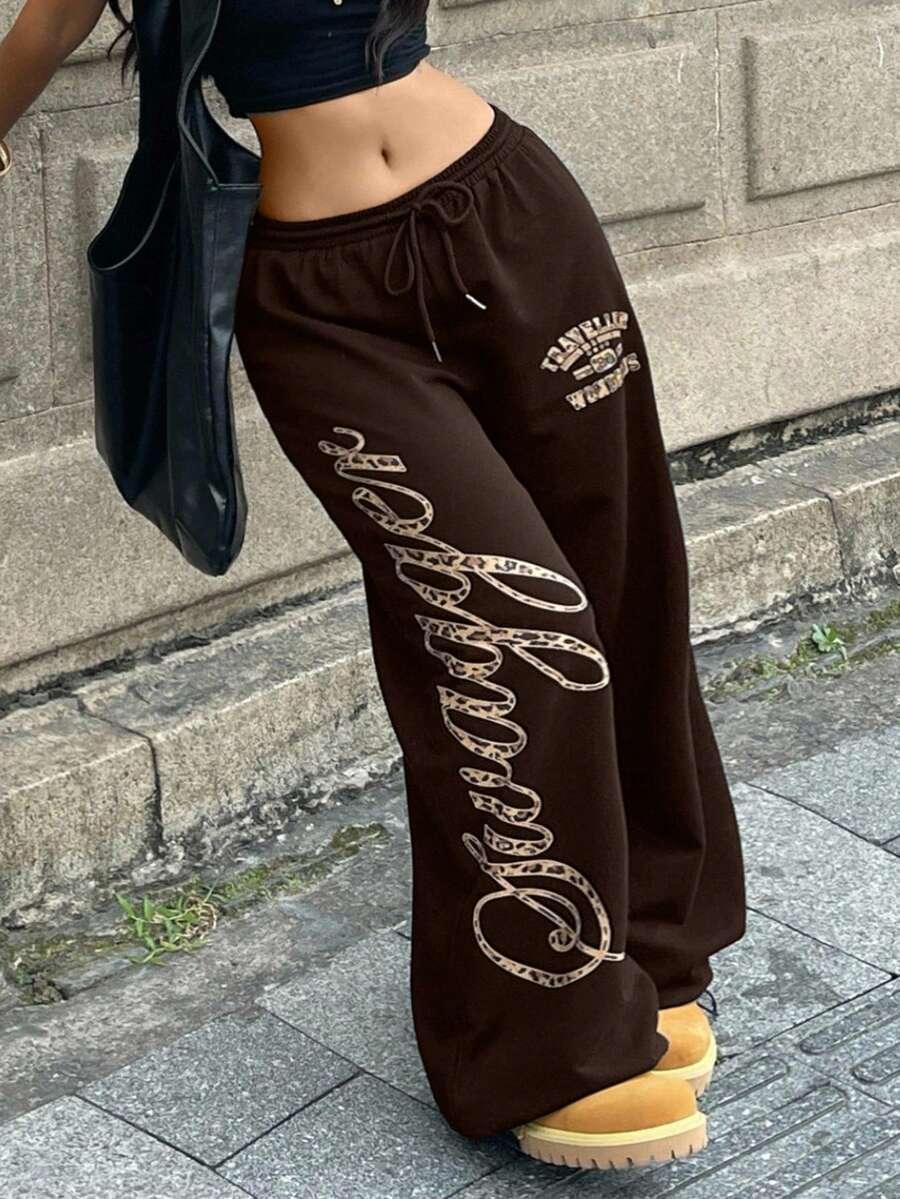 Brown cotton Swaggier sweatpants with leopard print lettering, casual streetwear style