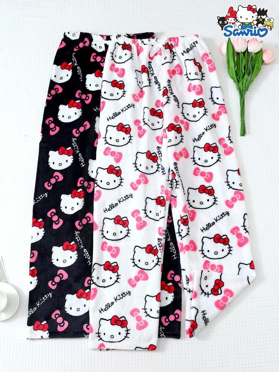 Hello Kitty pajama pants in black and white, soft fleece material, cute cartoon print by Sanrio