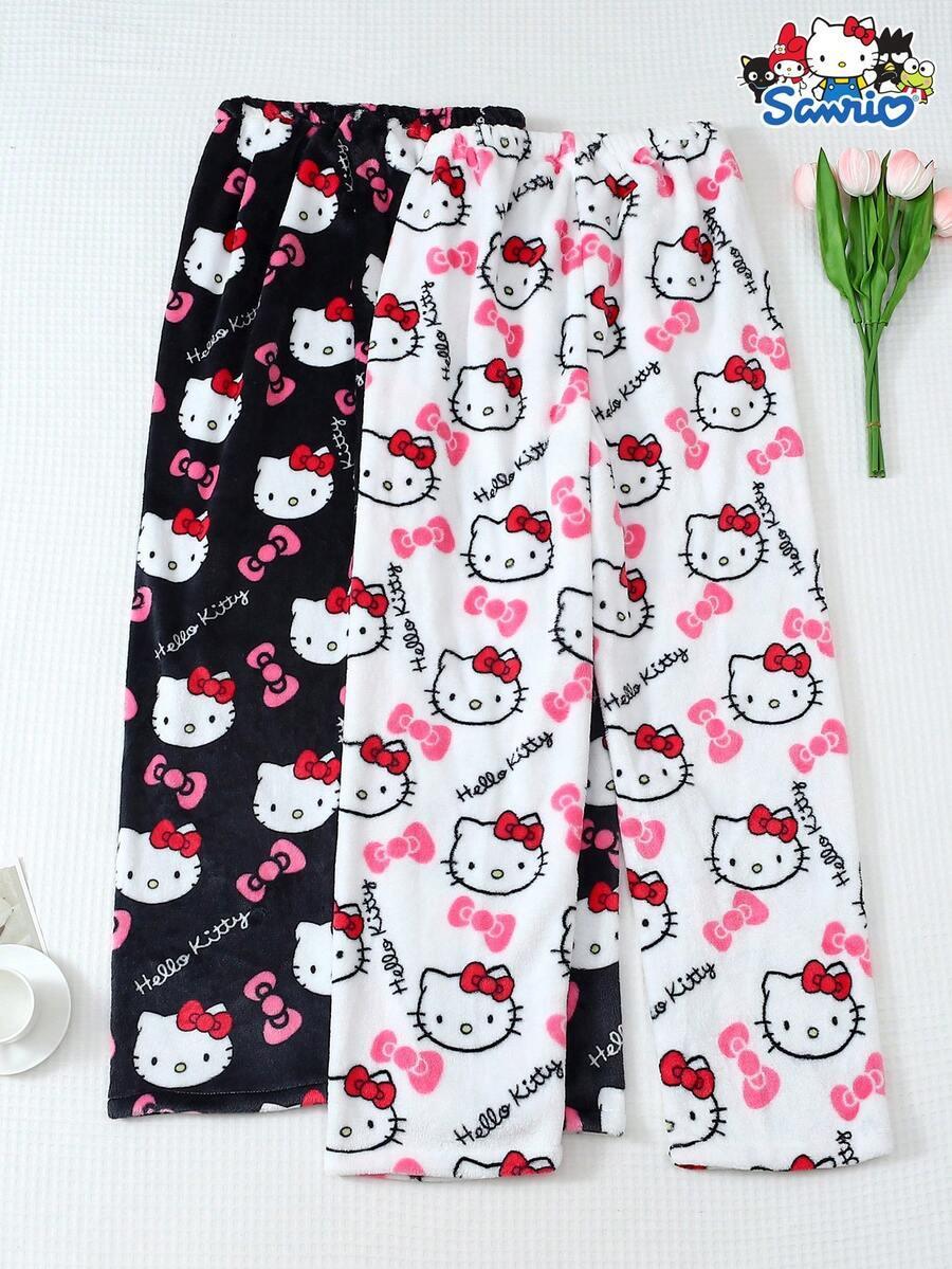 Hello Kitty pajama pants in black and white, soft fleece material, cartoon print, pink bows