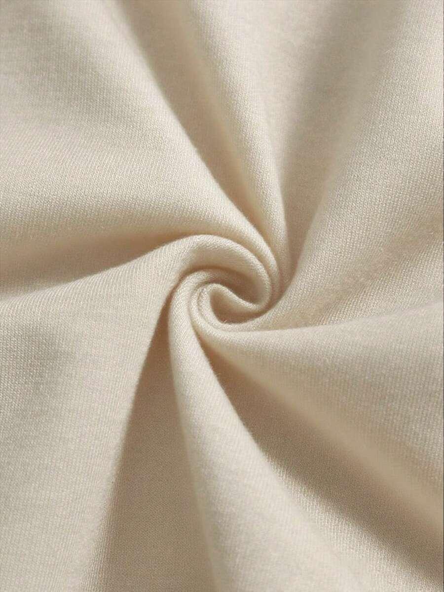 Beige cotton fabric detail from HUSTLE801 Hello Kitty pajama set, soft and cozy texture