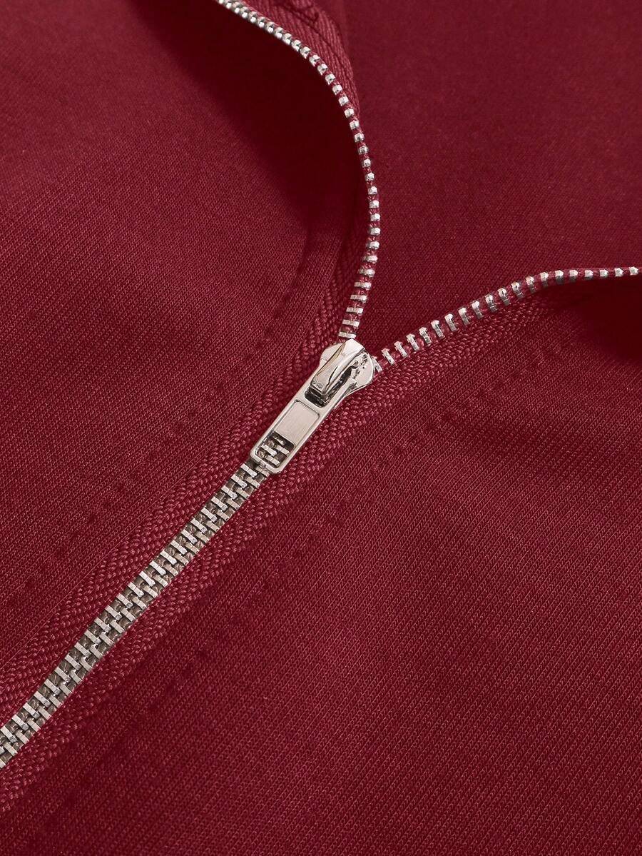 Close-up of maroon cotton zip-up hoodie with silver zipper, HUSTLE801 That Girl Hoodie