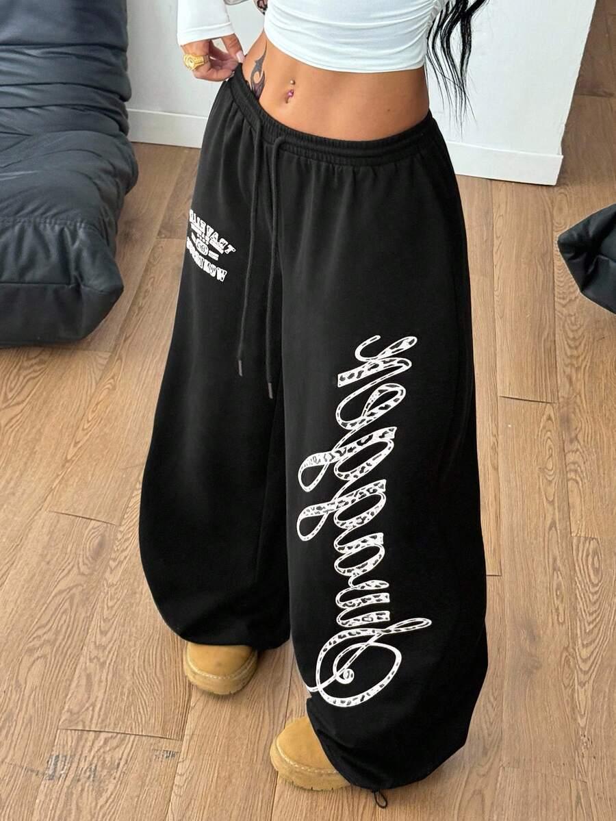 Black cotton HUSTLE801 Chinchilla baggy sweatpants with white lettering, relaxed fit