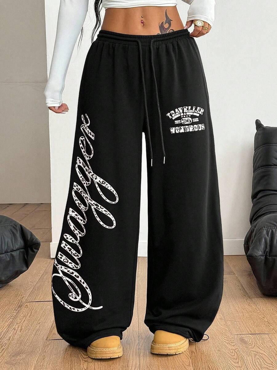 Black cotton HUSTLE801 Swagger sweatpants with bold white lettering and relaxed fit