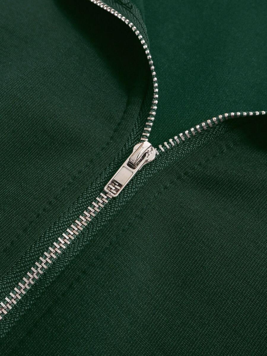Forest green cotton zip-up detail on HUSTLE801 That Girl hoodie