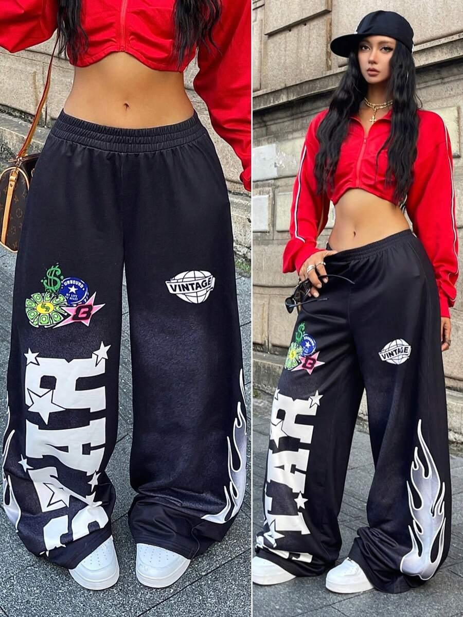 Black cotton STAR Vintage patchwork baggy pants with white flame graphics, worn with red crop jacket.