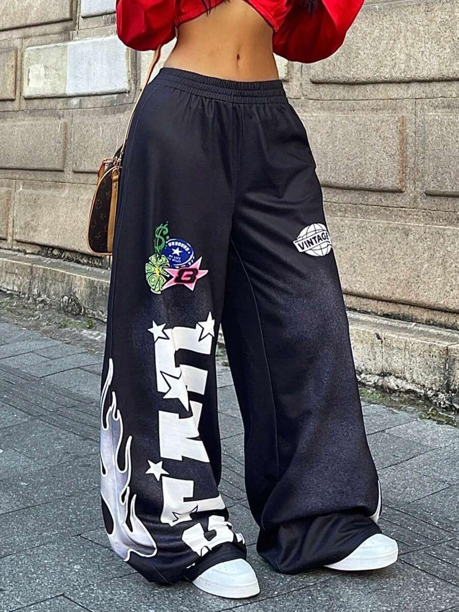 Black cotton HUSTLE801 baggy graphic jogger pants with patches and flame print, street style