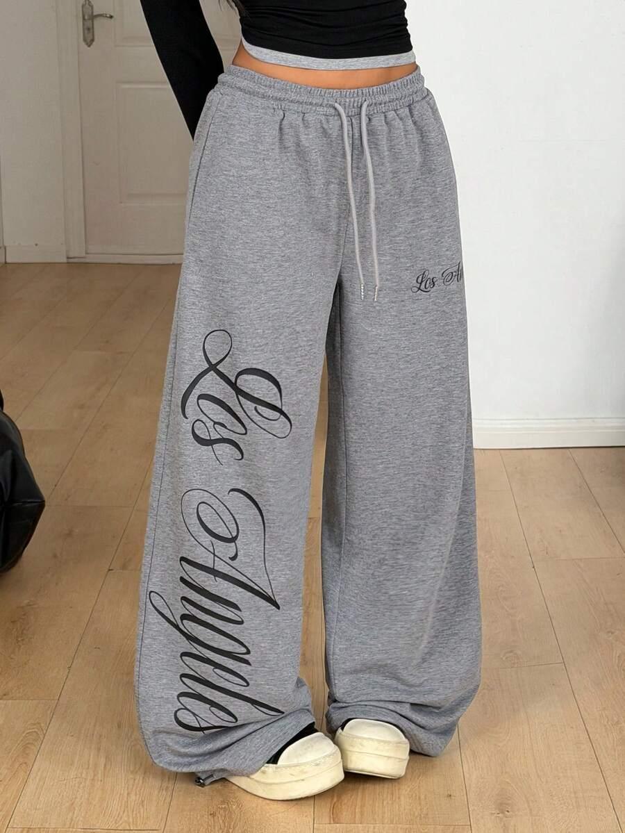 Gray cotton Los Angeles sweatpants with bold script print, oversized fit, elastic waist, casual streetwear