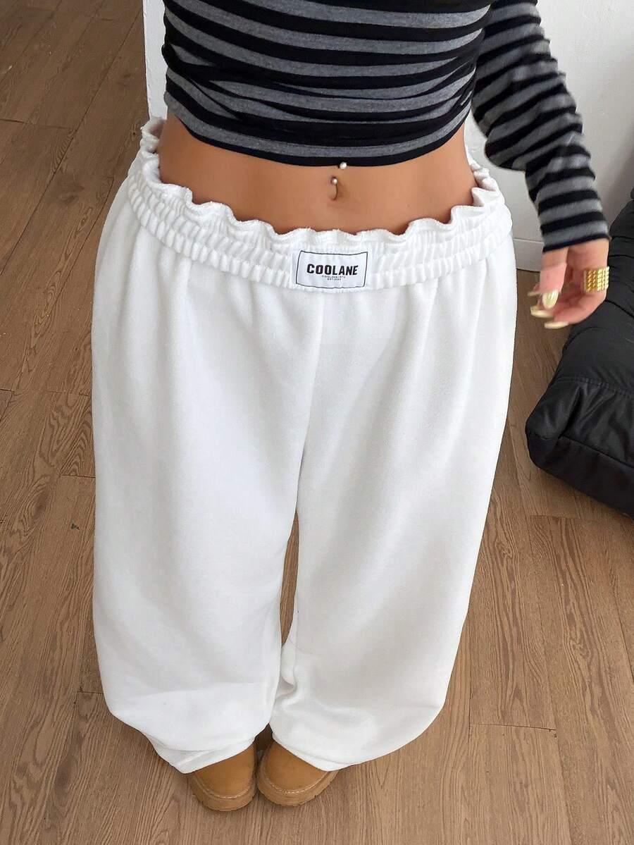 COOLANE white cotton wide-leg sweatpants with elastic waistband, cozy streetwear style