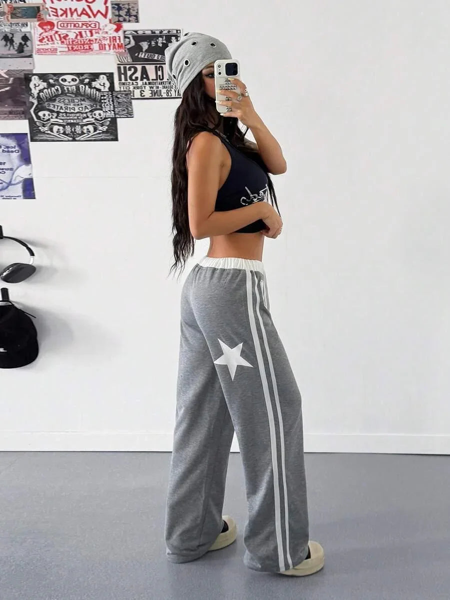 That Girl beanie and gray cotton Star Sweatpants with white stripes, casual streetwear fashion