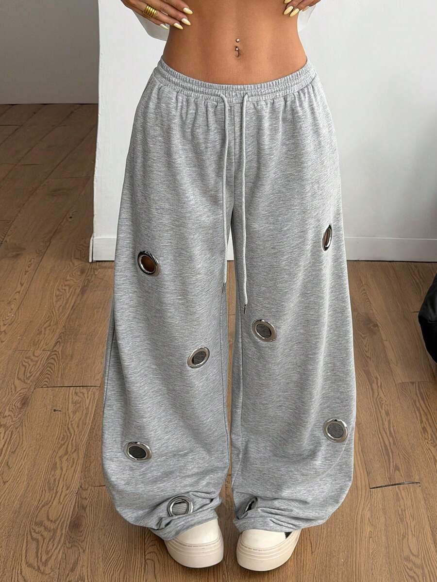 Grey cotton baggy sweatpants with metal ring accents from HUSTLE801, wide leg, streetwear style