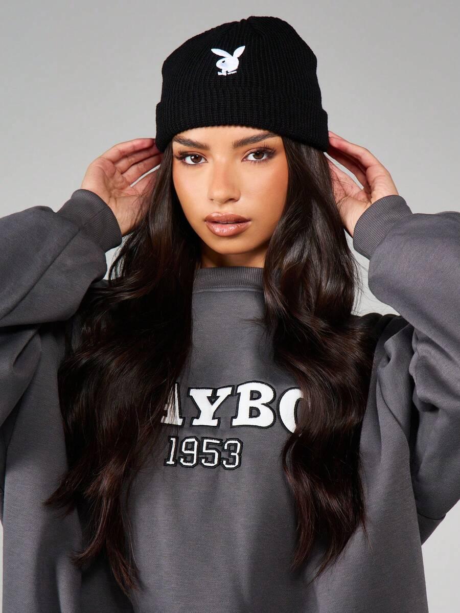 Black cotton Playboy beanie with white logo, model in charcoal sweatshirt, HUSTLE801 accessories