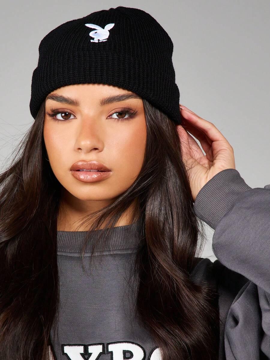 Black ribbed knit Playboy bunny beanie, cotton material, on model with long hair, casual style
