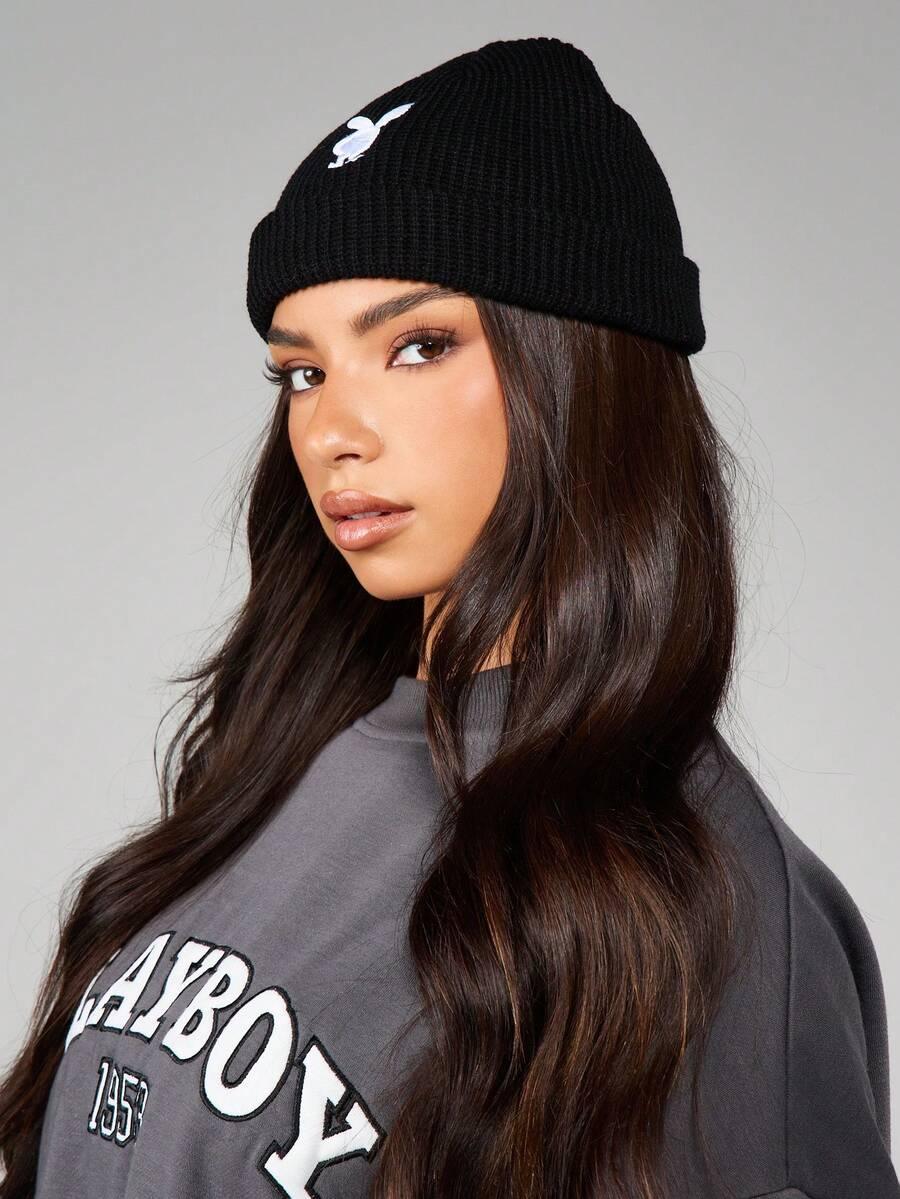 Black knit cotton beanie with white bunny logo by HUSTLE801, worn with grey crewneck sweatshirt