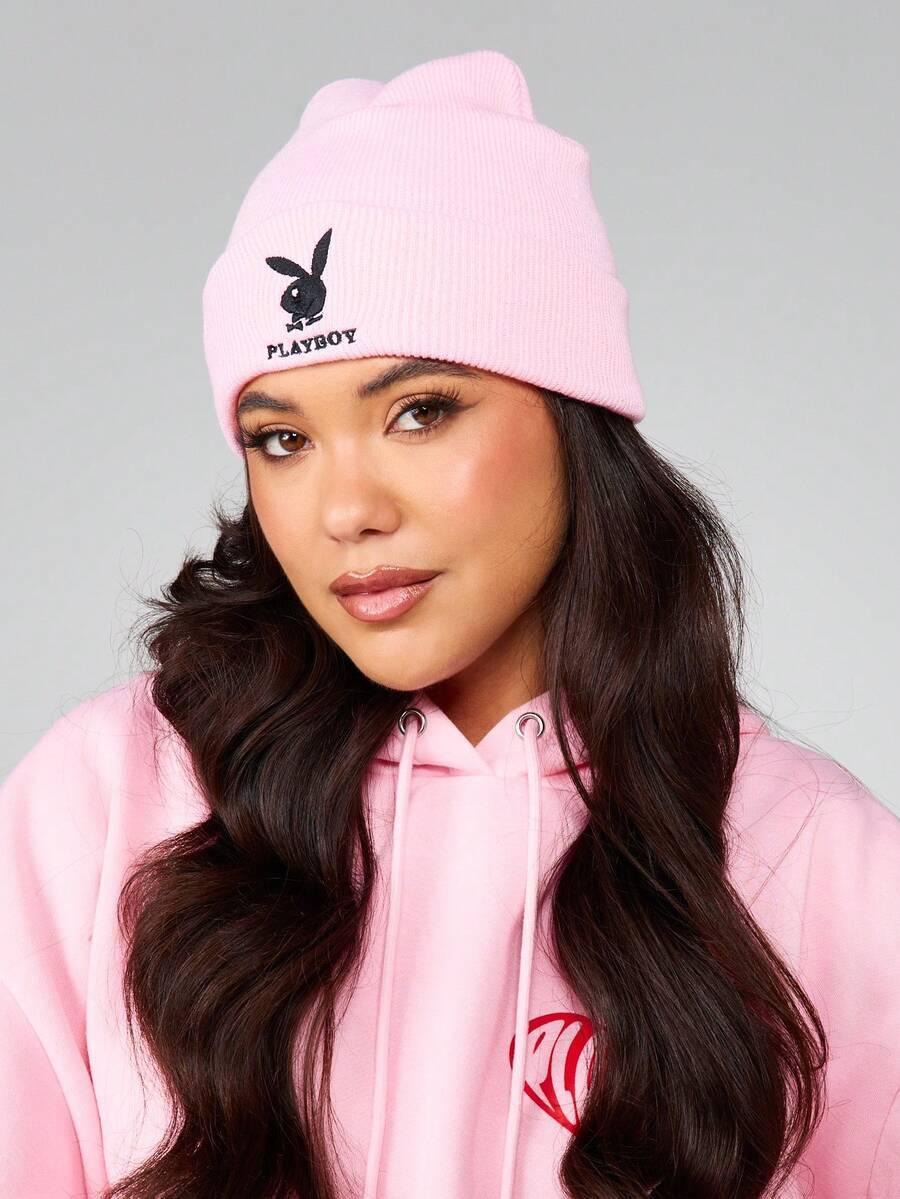 Woman wearing pink cotton PLAYBOY beanie and matching pink hoodie from HUSTLE801