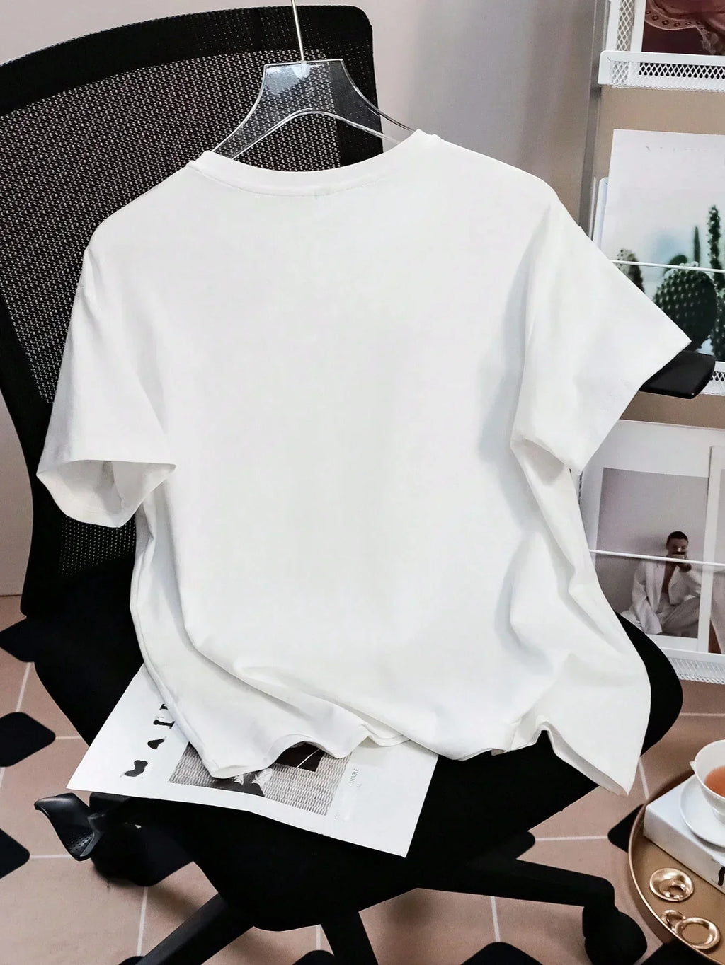 White cotton oversized T-shirt on chair, HUSTLE801 Baggy Tee, minimalist casual style