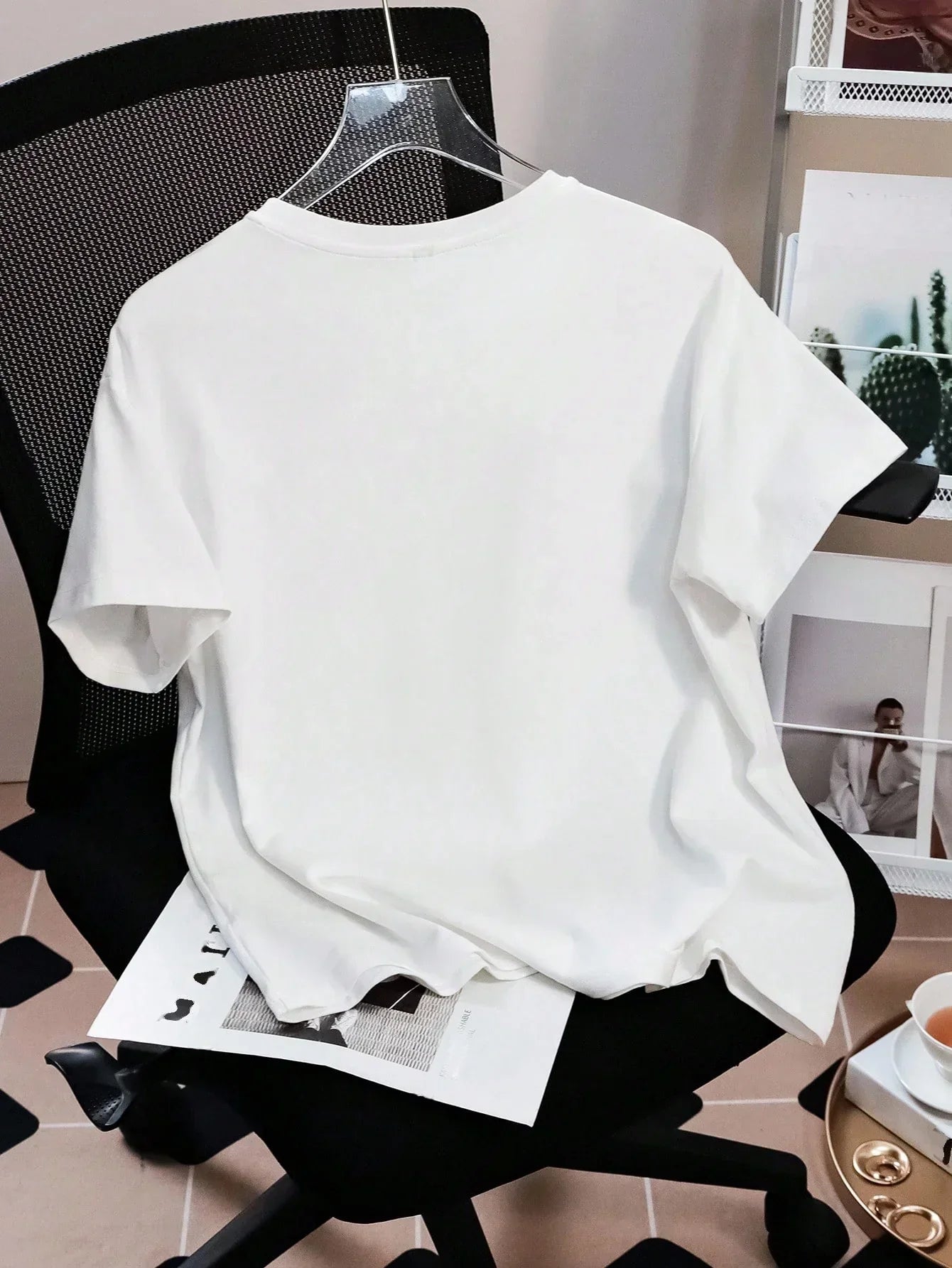 White cotton oversized T-shirt on chair, HUSTLE801 Baggy Tee, minimalist casual style