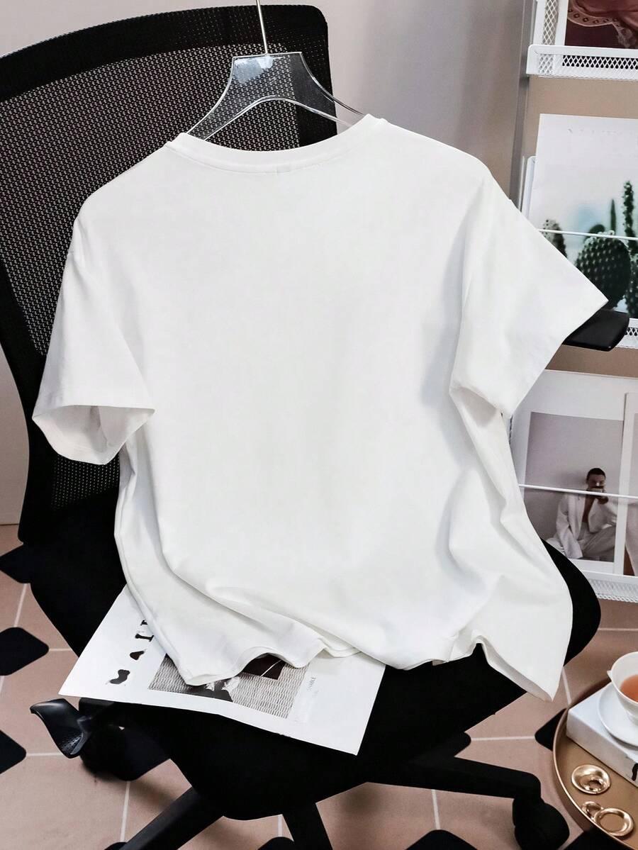 White cotton HUSTLE801 Basic Tee on hanger, minimalist office setting, casual streetwear essential