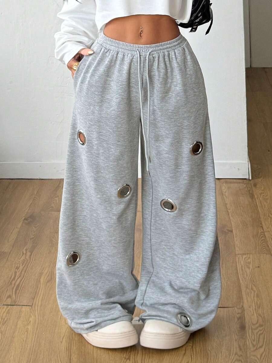 HUSTLE801 silver eyelet baggy sweatpants in light grey cotton with wide leg design