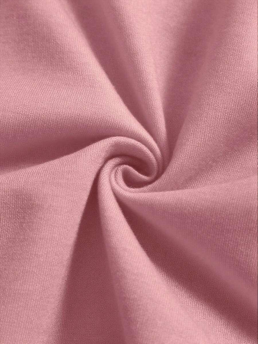 Pink cotton fabric detail from HUSTLE801 Hello Kitty pajama set, soft texture, close-up view