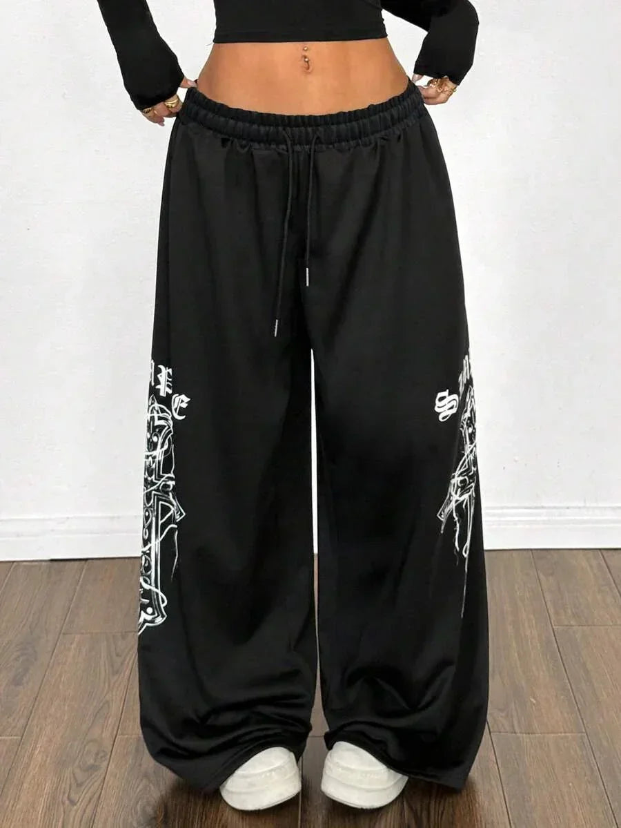 Black cotton That Girl Sweatpants with white graphic print, baggy fit from HUSTLE801