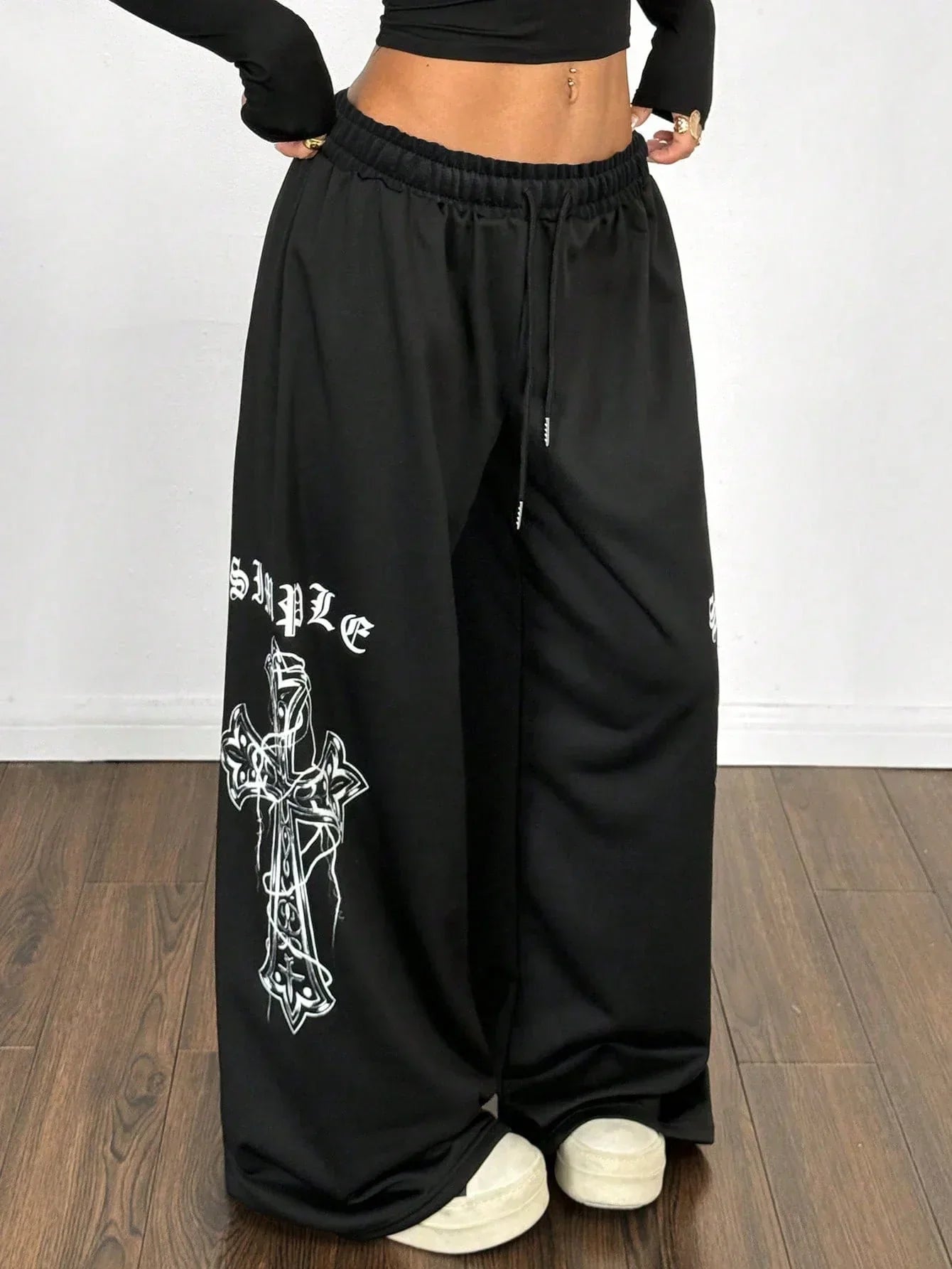 Black cotton baggy pants with white cross print from HUSTLE801, wide leg streetwear style