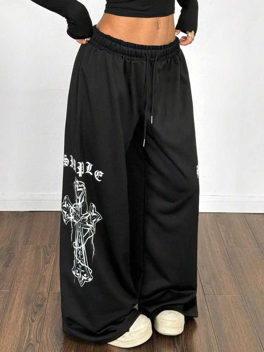 HUSTLE801 black cotton wide leg joggers with white cross graphic and gothic lettering detail
