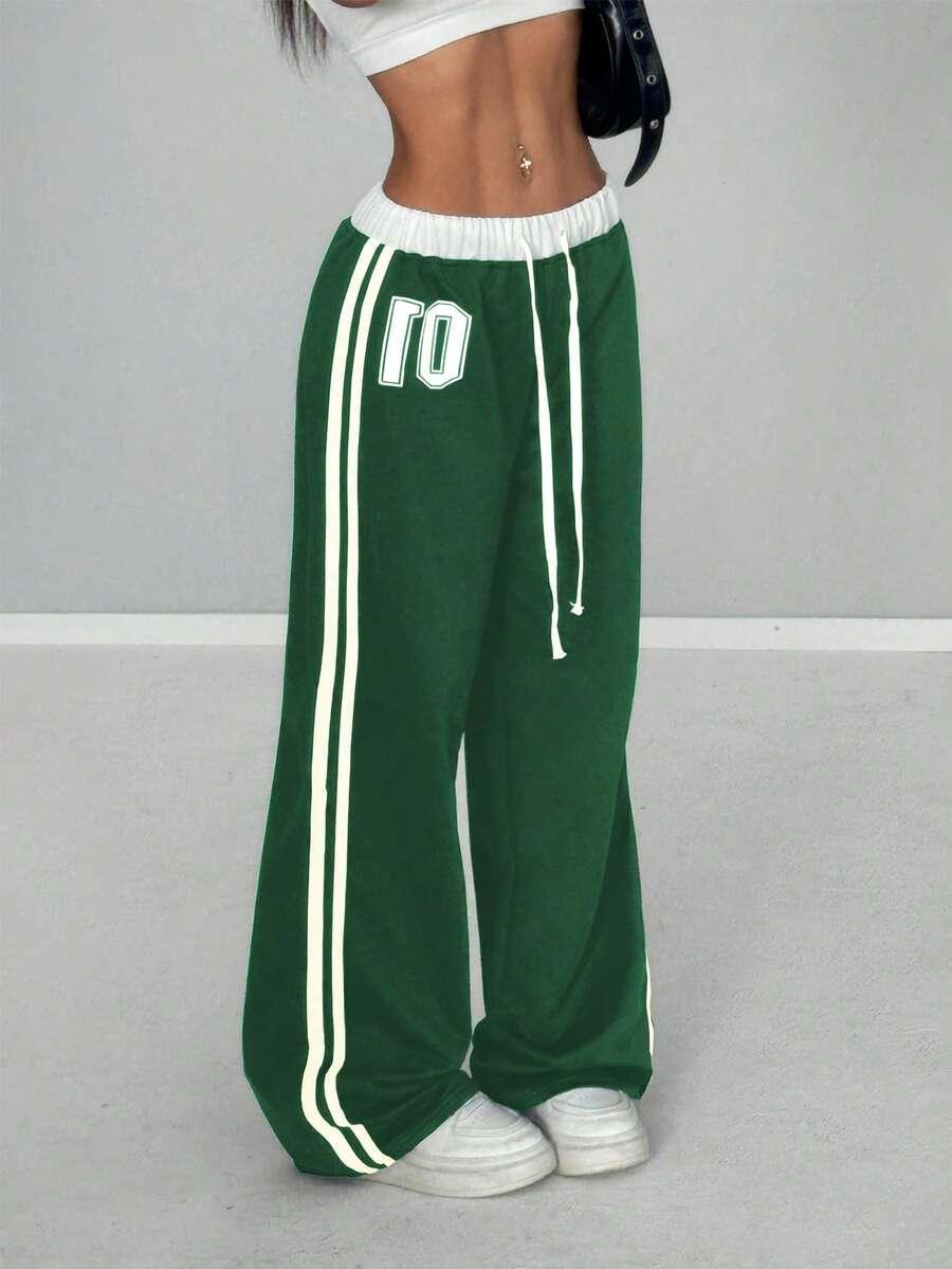 Green cotton 01 wide leg sweatpants with white stripes and drawstring waist from HUSTLE801